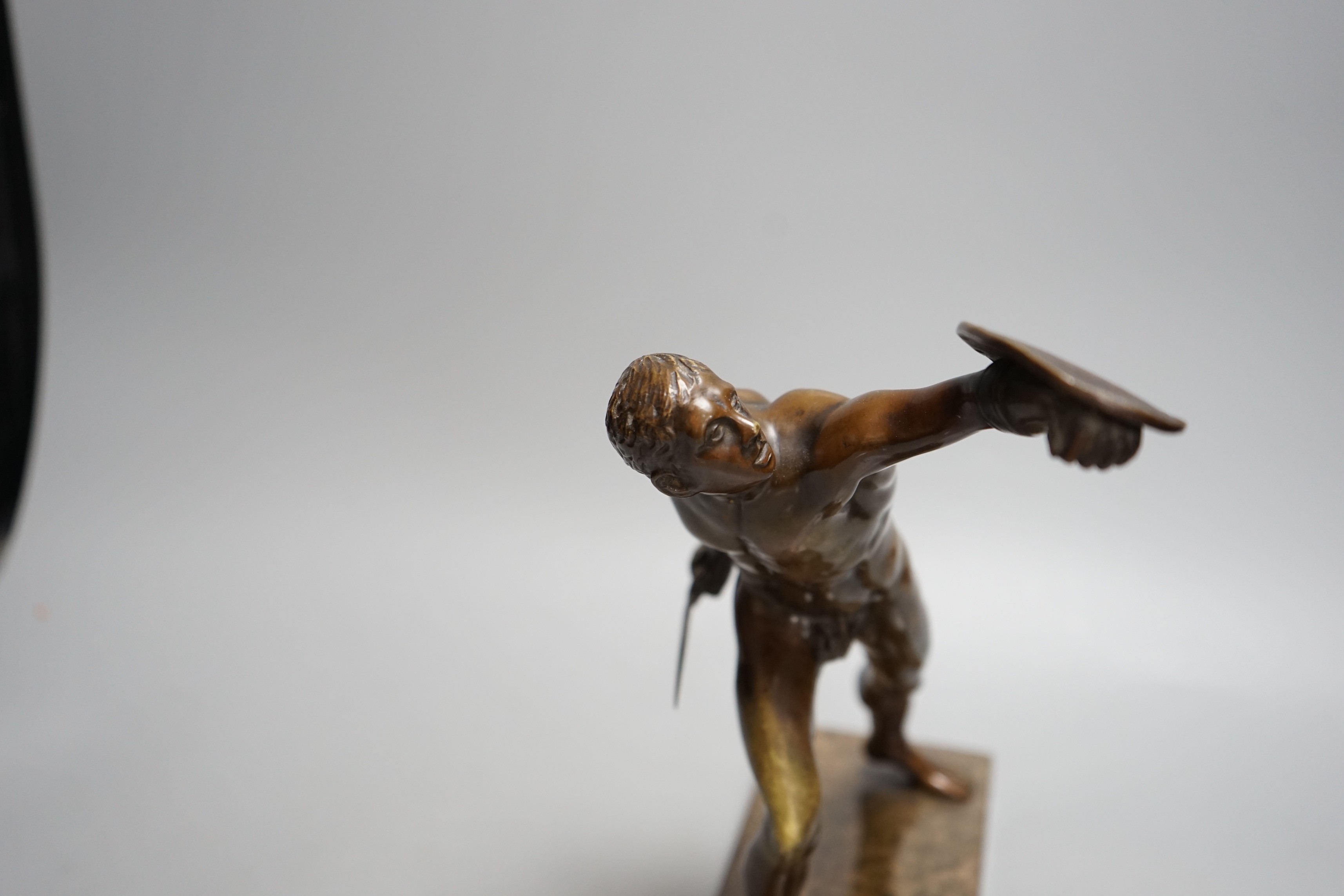 After the Antique, an early 20th century bronze study of the Borghese Gladiator, on marble base, 26cm tall